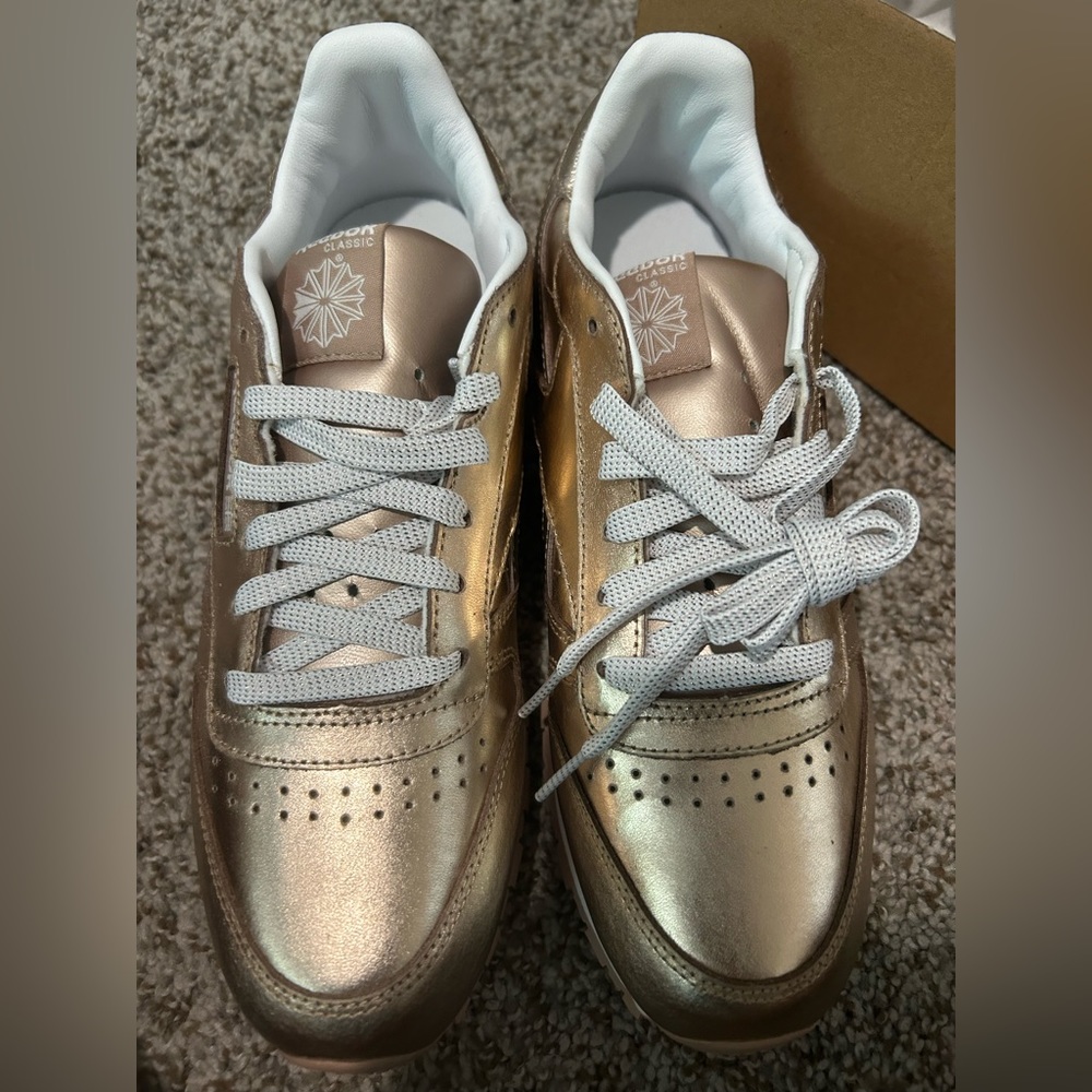 women size 6 rose gold reebok sneaker, brand new, never worn.